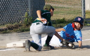 TP 11U baserunner Eli (8) ratchets up the pressure on the York 11U defense with a deft theft of third base in the first inning.