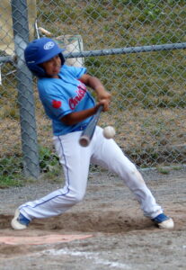 With two outs, Kai U. (2) drives home a clutch insurance run for TP 11U in the bottom of the fifth inning. Kai U. sparked the TP attack by going 3 for 3 at the plate [three singles], with two runs scored, a RBI and three stolen bases.