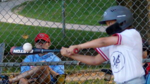 With his keen eye on the prize, Max (5) deliver a wooly mammoth one out two RBI triple that staked the Expos to an early 2-0 lead in the top of the first inning during a 2025 TPBA House League Tournament 11U Mosquito Division Semi-Final Game at Christie Pits Diamond 3.