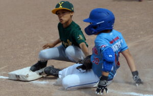 With two outs, York 11U Minor third baseman Carter (8) tags out TP 11U baserunner Levi (10) on a nifty 2-5 play in the top of the fifth inning.